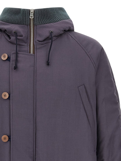 This Hooded Parka by Magliano for men in virgin wool & cotton purple presents a enveloping silhouette, meticulously detailed with pockets, hooded & insulated and a enveloping hooded neckline.