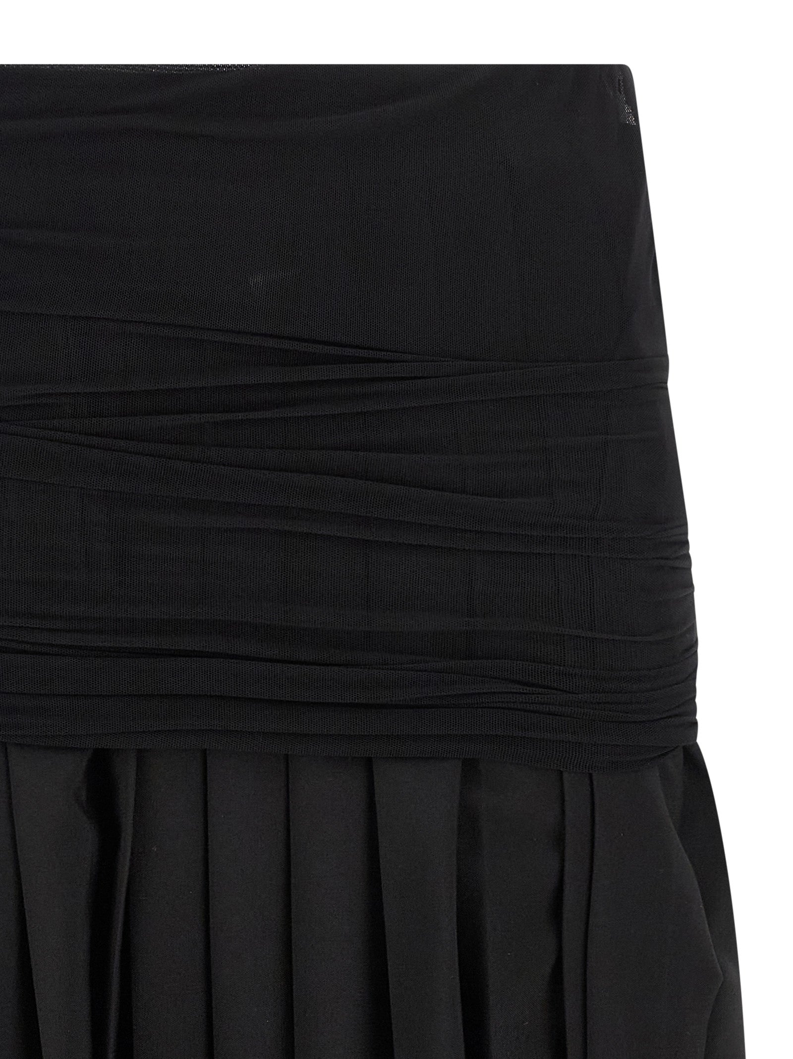 Skirt by MM6 Maison Margiela for women in wool & polyester black showcases a sultry silhouette, elegantly defined by its midi and the sophisticated sultry design of the Women's Pleated Flared Wool & Polyester Midi Skirt.