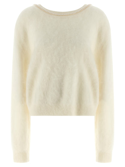 Cardigan by BERNADETTE for women in cashmere pearl & white features a nuanced silhouette with a refined round neckline and nuanced long-sleeve detailing for a sophisticated look.