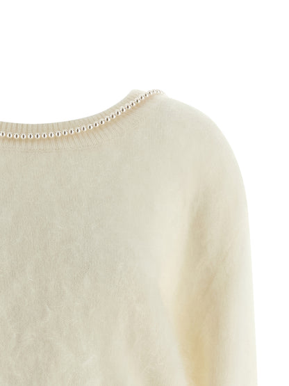 Cardigan by BERNADETTE for women in cashmere pearl & white showcases a captivating silhouette, artfully detailed with a captivating and round neckline for a truly sophisticated captivating look.