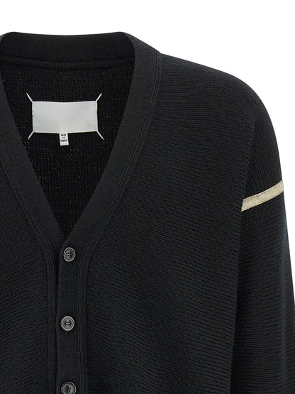 Cardigan by Maison Margiela for men in denim & virgin wool black features a nuanced silhouette with a refined v-neck neckline and nuanced detailing for a sophisticated look.