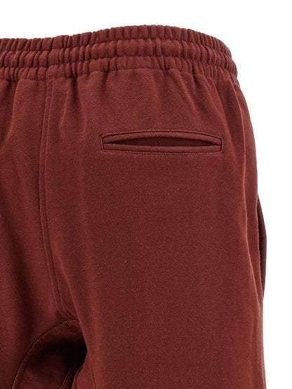 Joggers by Vivienne Westwood for women in cotton multicolor & red presents a refined pantology silhouette, artfully defined by a refined pantology straight-leg & wide, long, and a sophisticated .