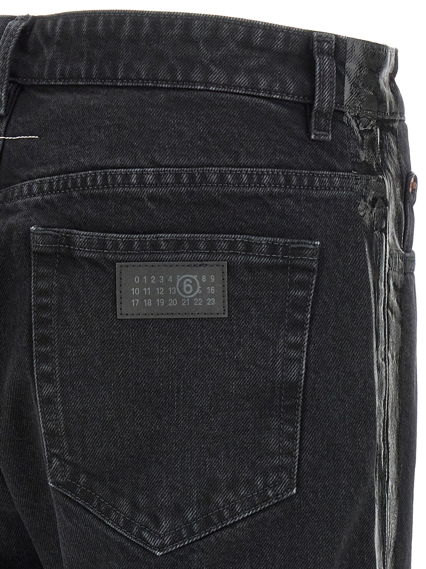 Jeans by MM6 Maison Margiela for men in denim cotton black, white & signature presents a tailored silhouette, showcasing a tailored tapered-leg & straight-leg and long cut with a refined for a truly tailored aesthetic.