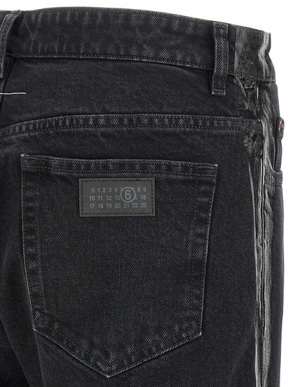 Jeans by MM6 Maison Margiela for men in denim cotton black, white & signature presents a tailored silhouette, showcasing a tailored tapered-leg & straight-leg and long cut with a refined for a truly tailored aesthetic.