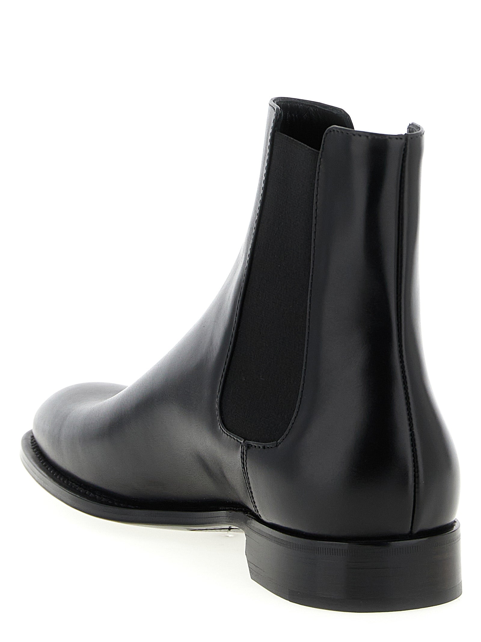 Ankle Chelsea Boots by Saint Laurent for men in calfskin leather black features an dynamic silhouette, showcasing the dynamic Men's Calfskin Leather Ankle Chelsea Boots design with its distinctive and elegant almond toe style.