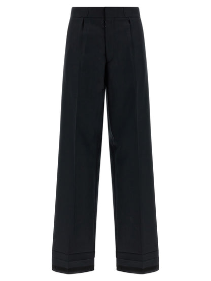 Trousers by Maison Margiela for women in wool & polyester black, herringbone & signature presents a smart silhouette, meticulously detailed with a smart straight-leg & wide, a smart long, and a smart .