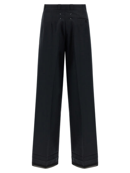 Trousers by Maison Margiela for women in wool & polyester black, herringbone & signature features a sculptural silhouette, showcasing a sculptural straight-leg & wide and long with a sophisticated for a sculptural finish.