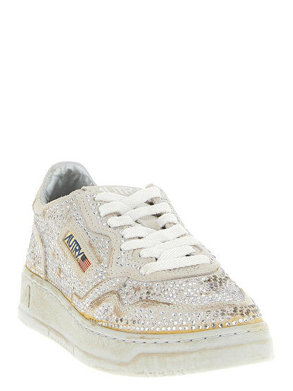 Sneakers by Autry for women in cotton & bos taurus suede cowhide leather beige presents a on trend silhouette from the Women's Chunky Cotton & Bos Taurus Suede Cowhide Leather Sneakers collection, showcasing a on trend chunky style for an elevated aesthetic.