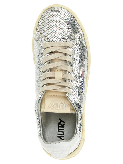 Sneakers by Autry for women in polyester cotton terrycloth & crocodile skin leather silver & print presents a on trend silhouette from the Women's Low Top Polyester Cotton Terrycloth & Crocodile Skin Leather Sneakers collection, showcasing a on trend low-top style for an elevated aesthetic.