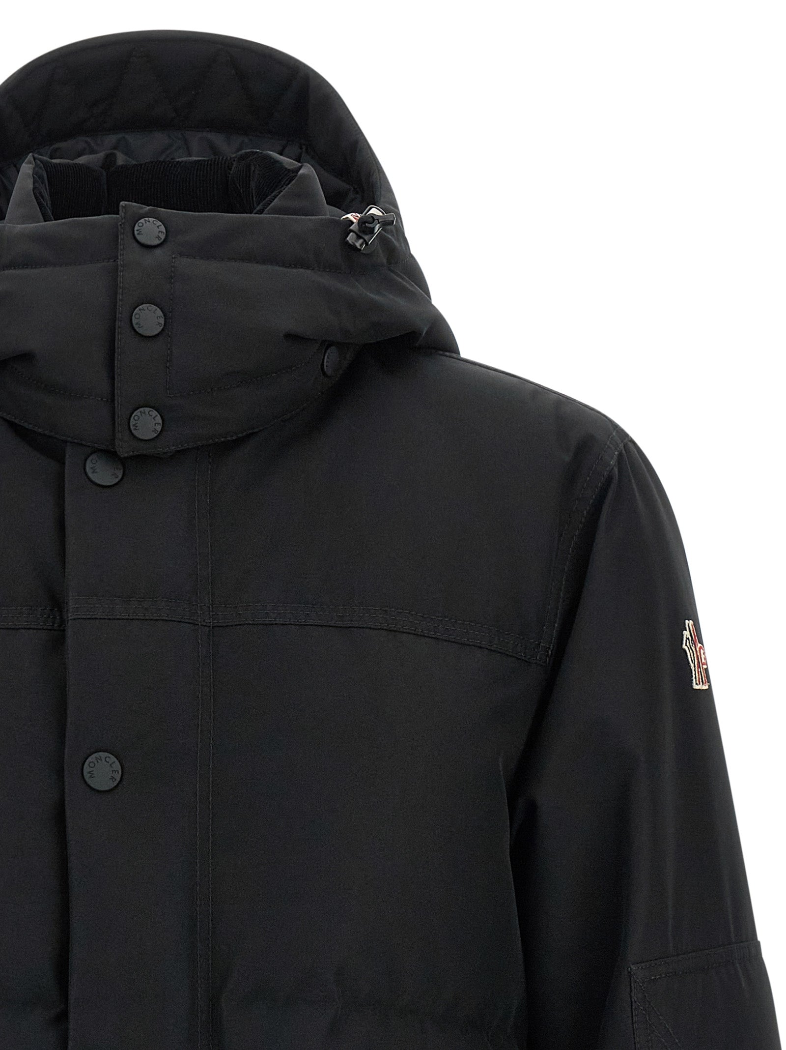 Hooded Windbreaker Jacket by Moncler Grenoble for men in polyester corduroy & goose-down black showcases a modern silhouette, integrating hooded, insulated & windproof and a modern hooded high-neck neckline for a sophisticated finish.
