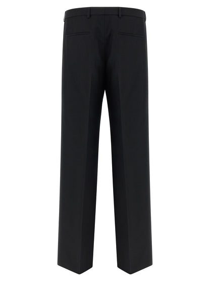 Trousers by Gucci for men in polyester black presents a smart silhouette, meticulously detailed with a smart straight-leg, a smart long, and a smart .