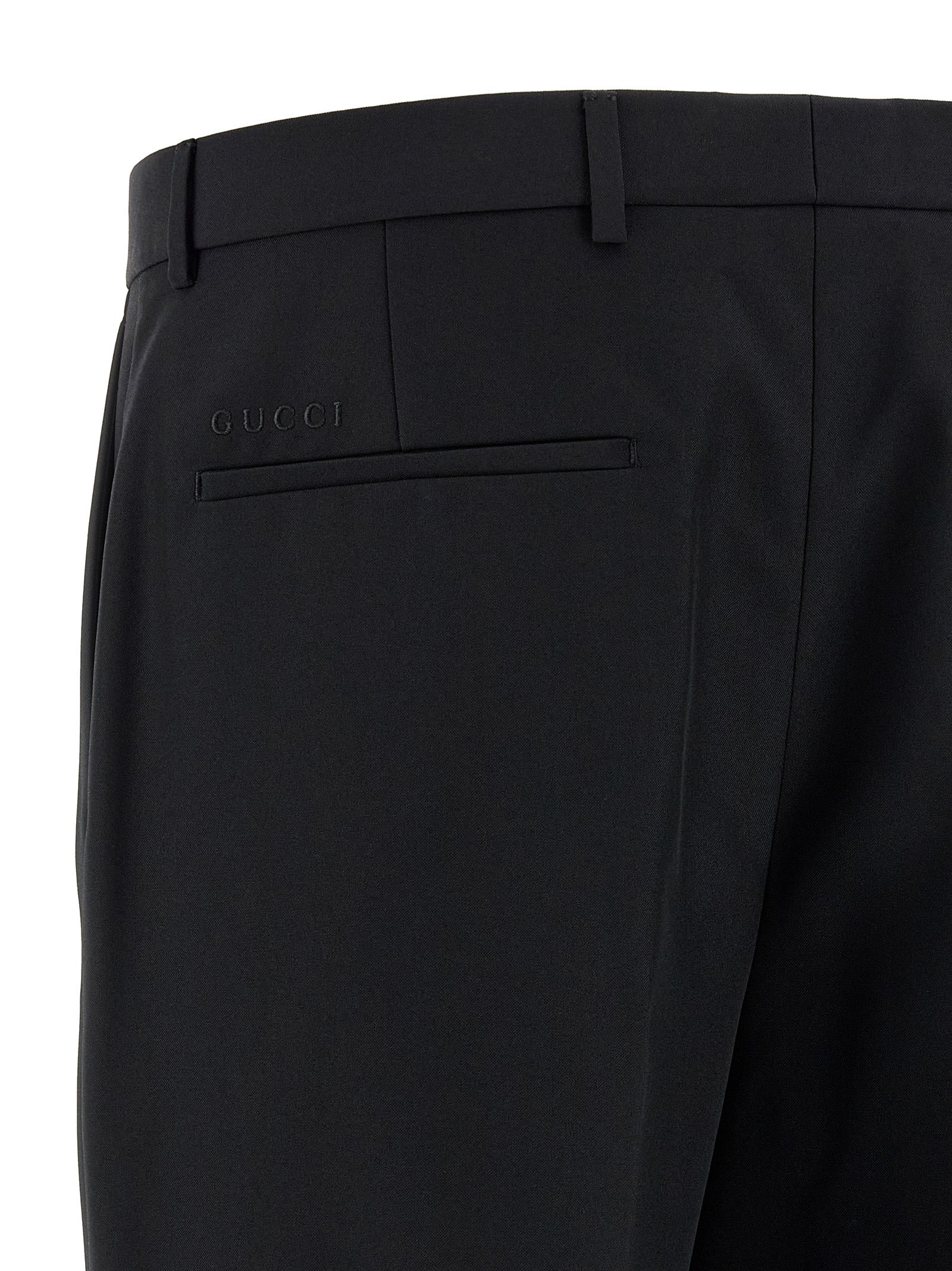 Trousers by Gucci for men in polyester black features a artisanal silhouette, showcasing a sophisticated straight-leg with a long and for a artisanal finish.
