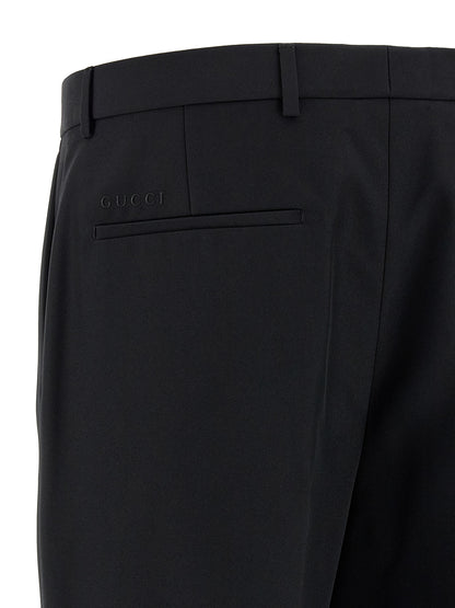 Trousers by Gucci for men in polyester black features a artisanal silhouette, showcasing a sophisticated straight-leg with a long and for a artisanal finish.