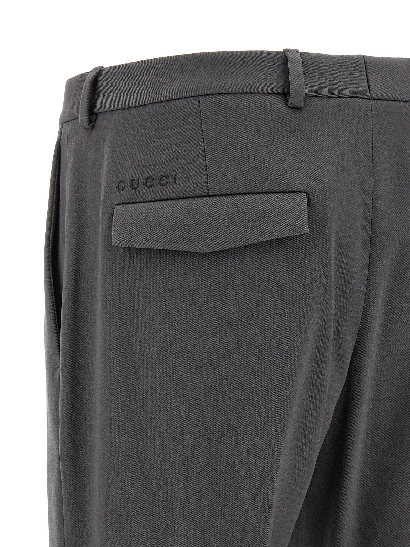 Trousers by Gucci for men in satin wool gray features a artisanal silhouette, showcasing a sophisticated straight-leg with a long and for a artisanal finish.