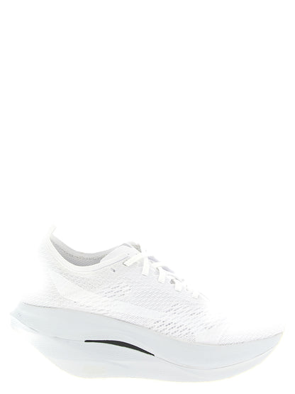 Athletic Sneakers by Comme Des Garçons for women in synthetic fabric white showcases a architectural silhouette, artfully capturing the essence of the Women's Athletic Synthetic Fabric Sneakers with its signature architectural athletic style construction.