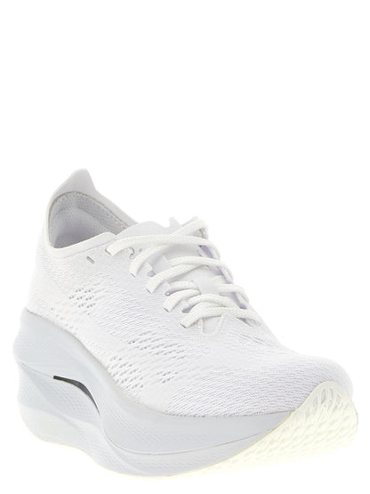 Athletic Sneakers by Comme Des Garçons for women in synthetic fabric white showcases an impeccable silhouette, defined by an impeccable athletic style design that perfectly captures the essence of the Women's Athletic Synthetic Fabric Sneakers.