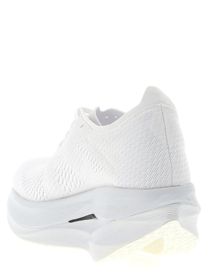 Athletic Sneakers by Comme Des Garçons for women in synthetic fabric white presents a sleek silhouette, perfectly capturing the athletic style essence of Women's Athletic Synthetic Fabric Sneakers with its sleek design and premium finish.