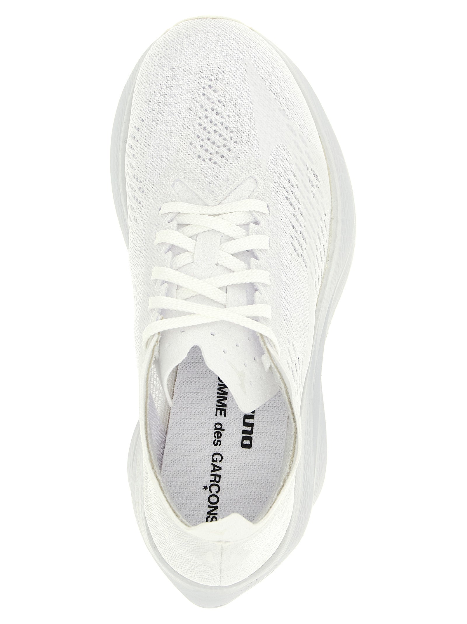 Athletic Sneakers by Comme Des Garçons for women in synthetic fabric white features an effortless chic silhouette, showcasing the signature athletic style of the Women's Athletic Synthetic Fabric Sneakers collection with a truly effortless chic finish.