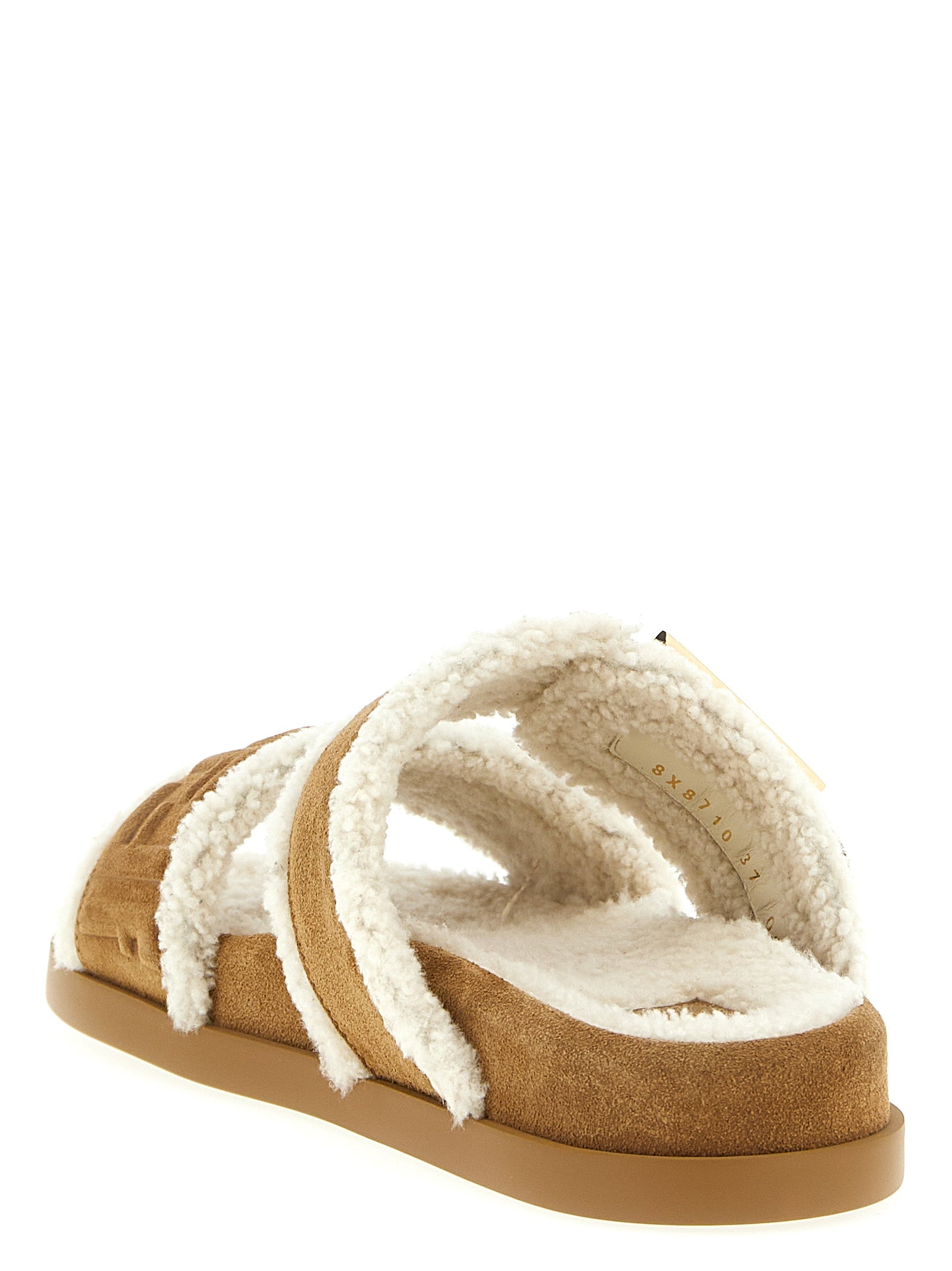Sliders Sandals Flat Shoes by Fendi for women in suede calfskin leather & fur beige & patterned presents a impeccable silhouette as Women's Suede Calfskin Leather & Fur Sliders Sandals Flat Shoes, artfully designed with a and a impeccable for a refined, upscale finish.