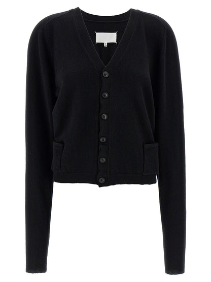 Cardigan by Maison Margiela for women in wool black & signature features an impeccable silhouette, showcasing a sophisticated v-neck neckline and long-sleeve detail for a truly impeccable finish.