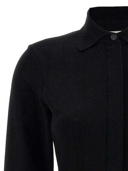 Blouse by Sportmax for women in polyester & viscose black features an architectural silhouette with a refined and elegant asymmetric neckline for a architectural look.