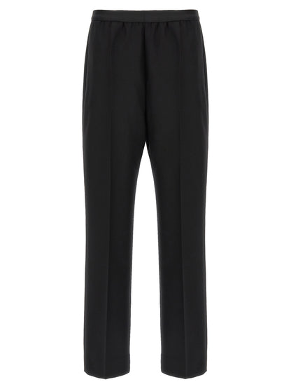 Trousers by Maison Margiela for women in virgin wool black features an sartorial silhouette, showcasing a precise straight-leg and long with a sartorial for a refined look.