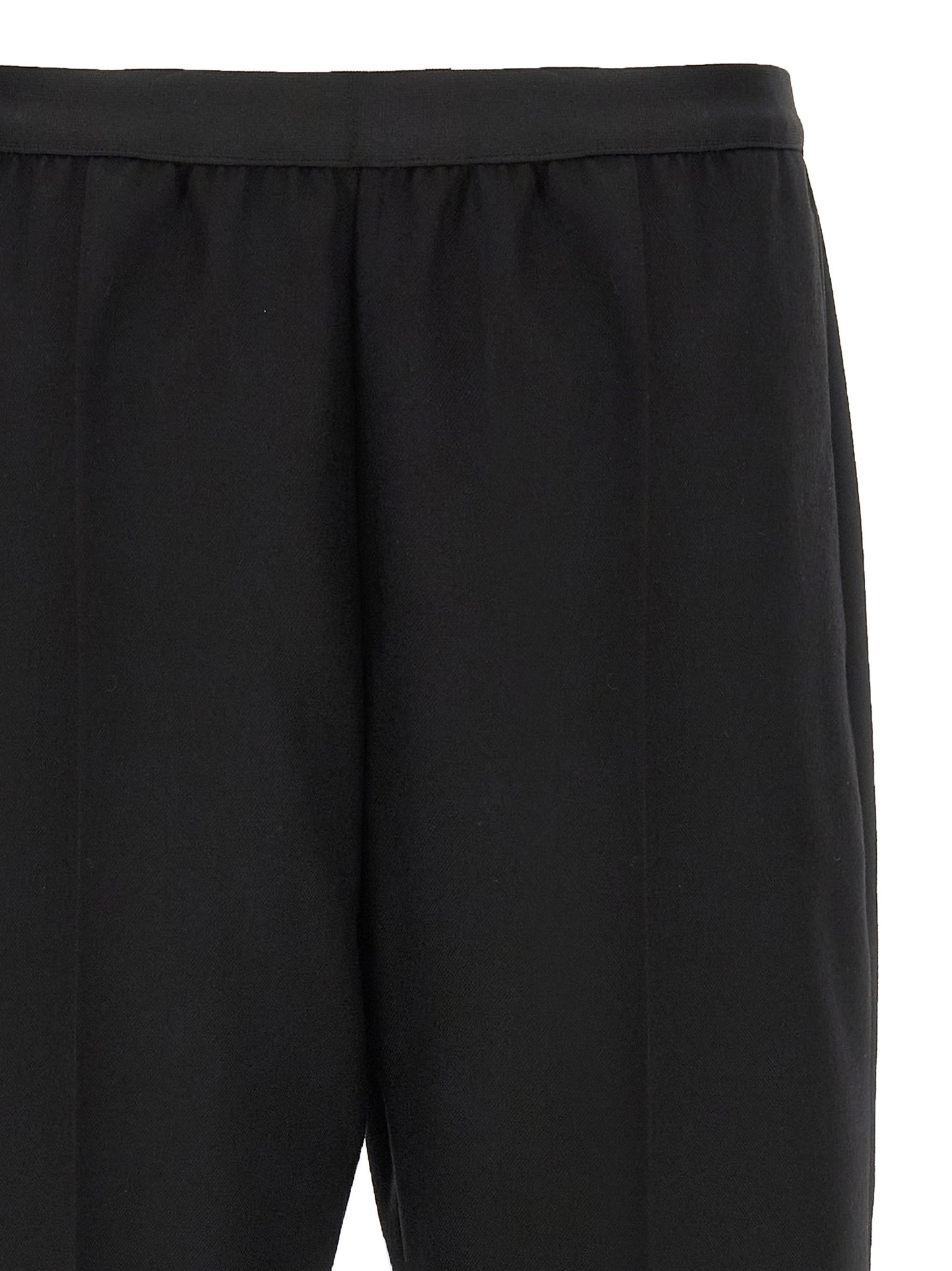 Trousers by Maison Margiela for women in virgin wool black features an on trend silhouette, showcasing a sophisticated straight-leg with a long and for an on trend finish.