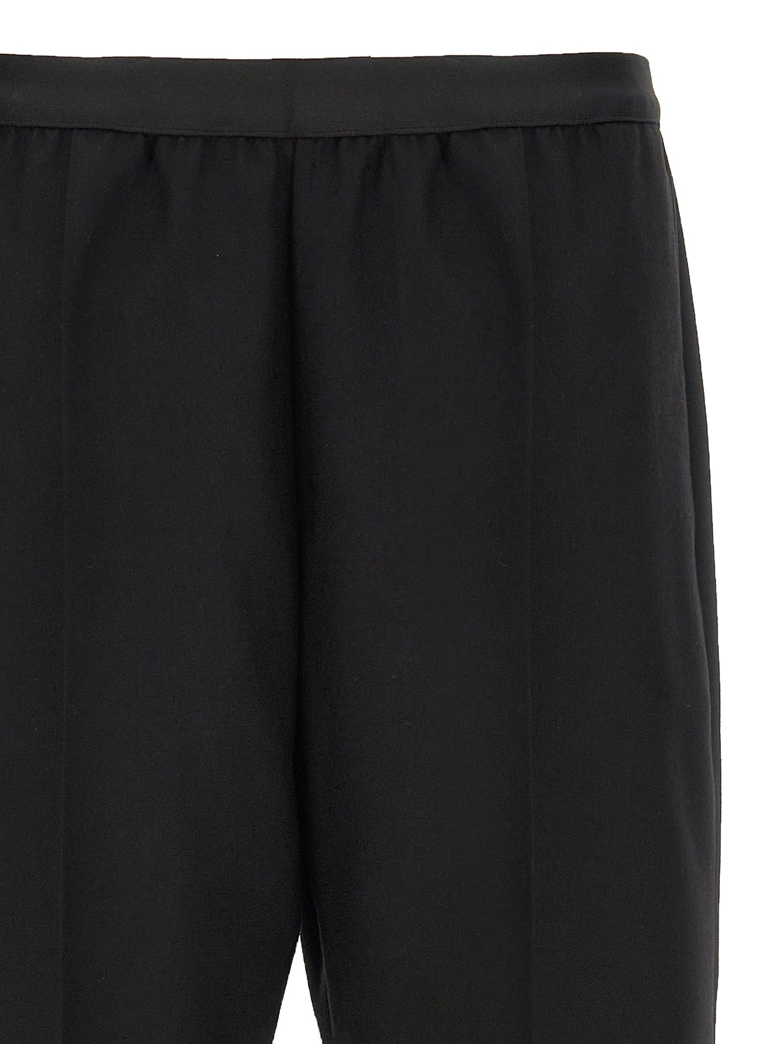 Trousers by Maison Margiela for women in virgin wool black features an on trend silhouette, showcasing a sophisticated straight-leg with a long and for an on trend finish.