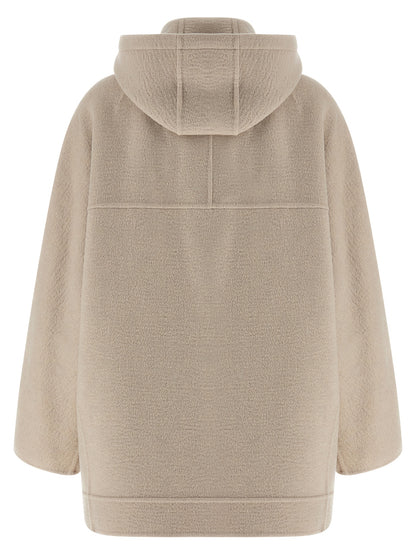 Hooded Trench Coat by Max Mara for women in cashmere & leather beige presents an sculptural silhouette, artfully detailed with a sculptural hooded neckline and functional pockets & hooded for a truly sculptural finish.