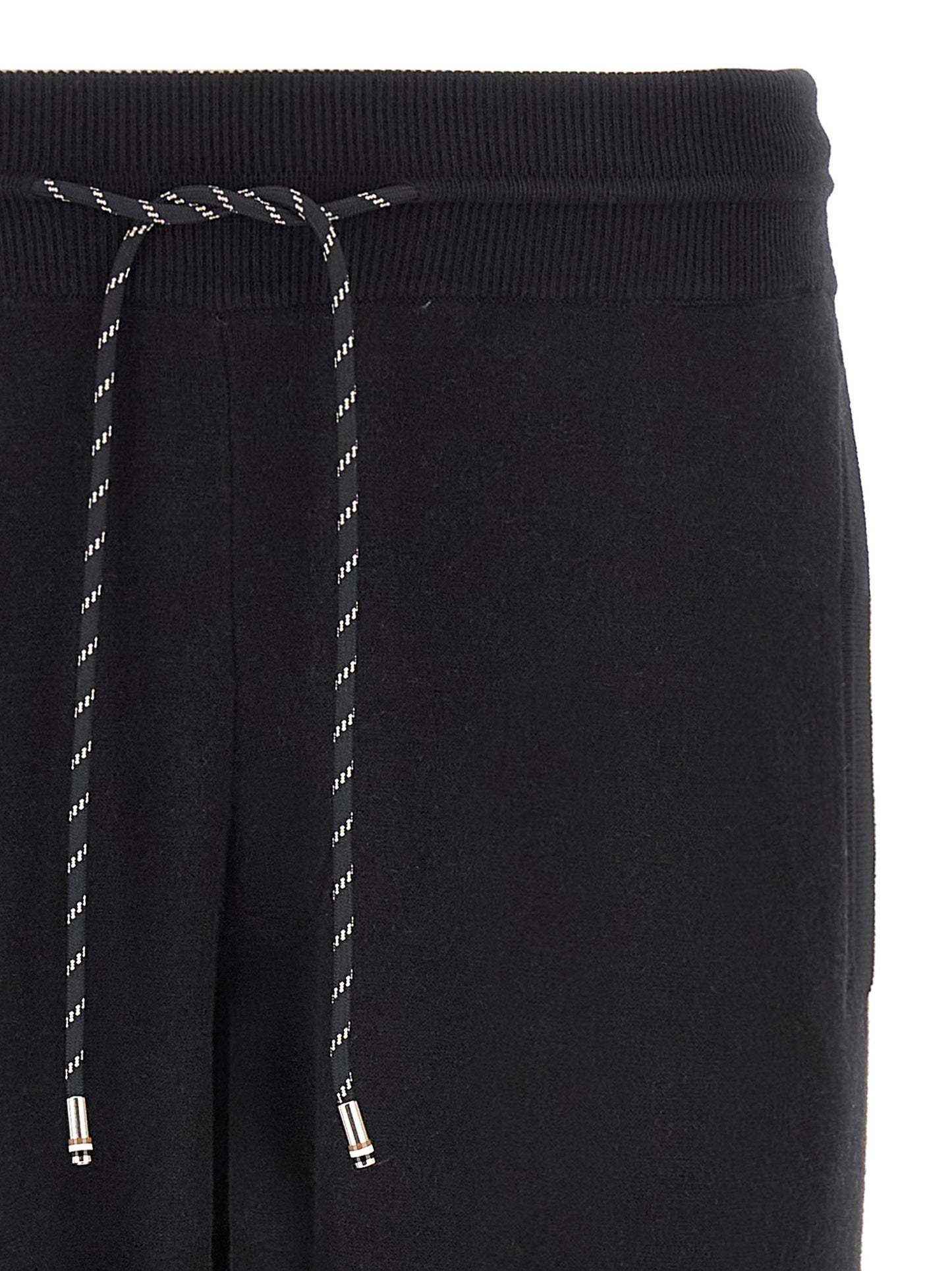 Joggers by Hugo Boss for men in plush virgin wool & cotton black features an sartorial and long with a cut for a sartorial finish.
