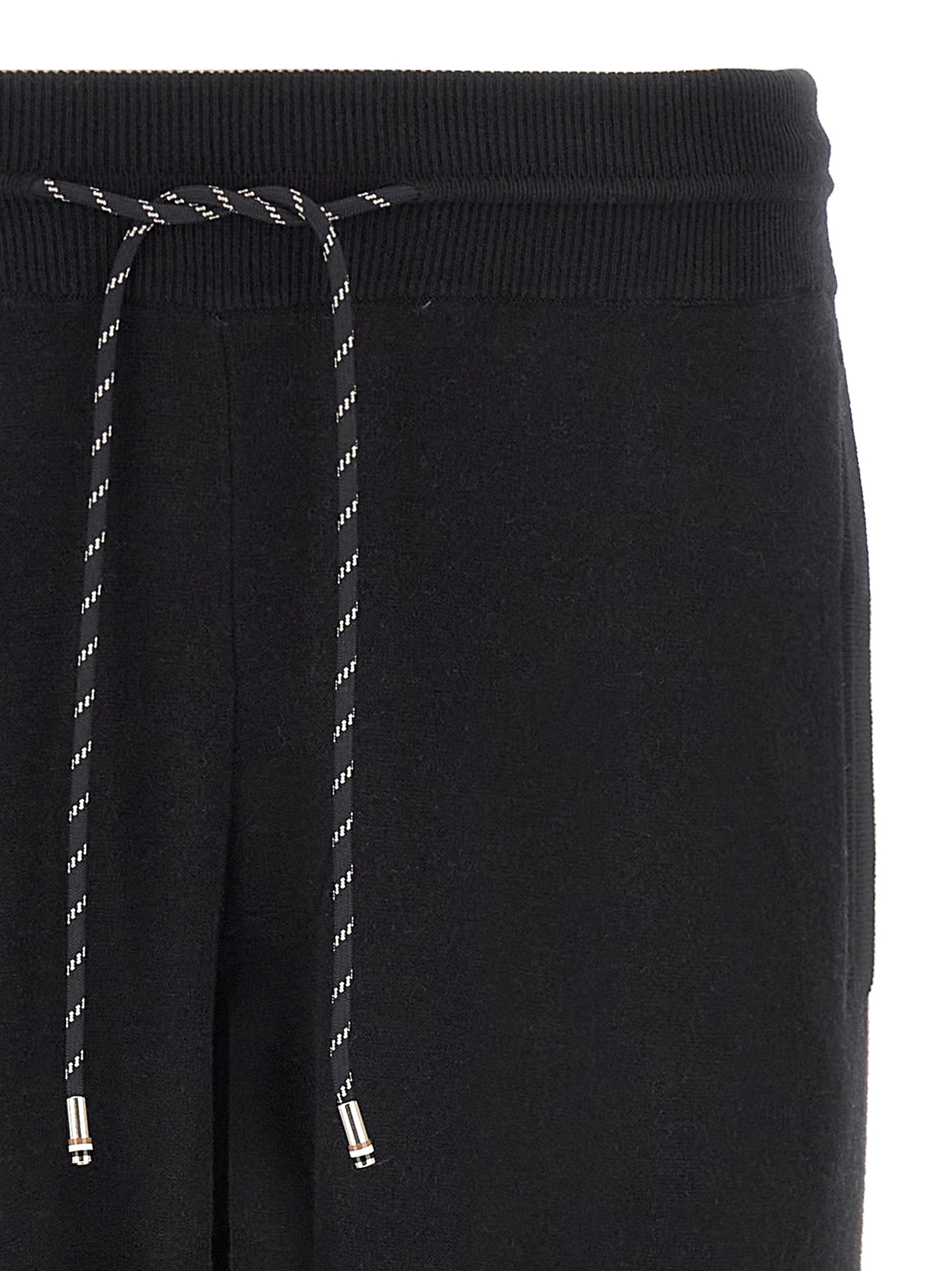 Joggers by Hugo Boss for men in plush virgin wool & cotton black features an sartorial and long with a cut for a sartorial finish.