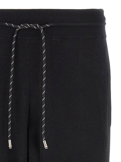 Joggers by Hugo Boss for men in plush virgin wool & cotton black features an sartorial and long with a cut for a sartorial finish.