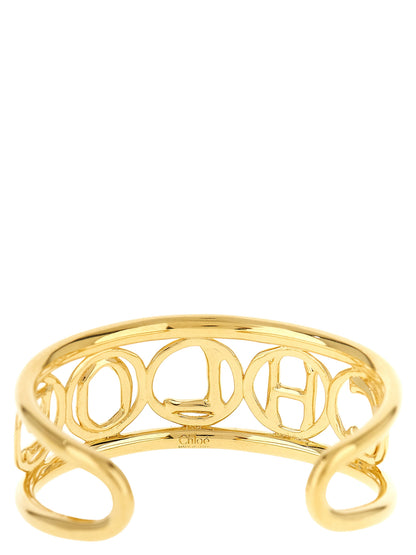 Bracelet by Chloé for women in denim cotton gold features an svelte silhouette, showcasing the svelte bangle charm bracelet design of the Women's Bangle Charm Gold Brass Bracelet for a sophisticated, svelte look.