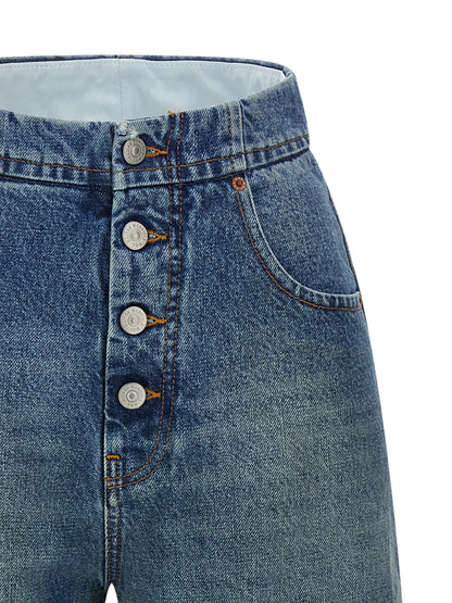 Jeans by MM6 Maison Margiela for women in denim cotton light-blue, white & signature presents a refined pantology silhouette, artfully defined by a refined pantology straight-leg, long, and a sophisticated high rise.
