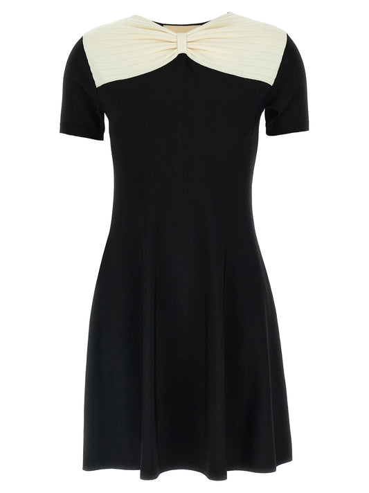 Dress by Valentino Garavani for women in polyester & viscose black features an cute silhouette, detailed with a short-sleeve and v-neck neckline that elegantly flows into a cute short mini.