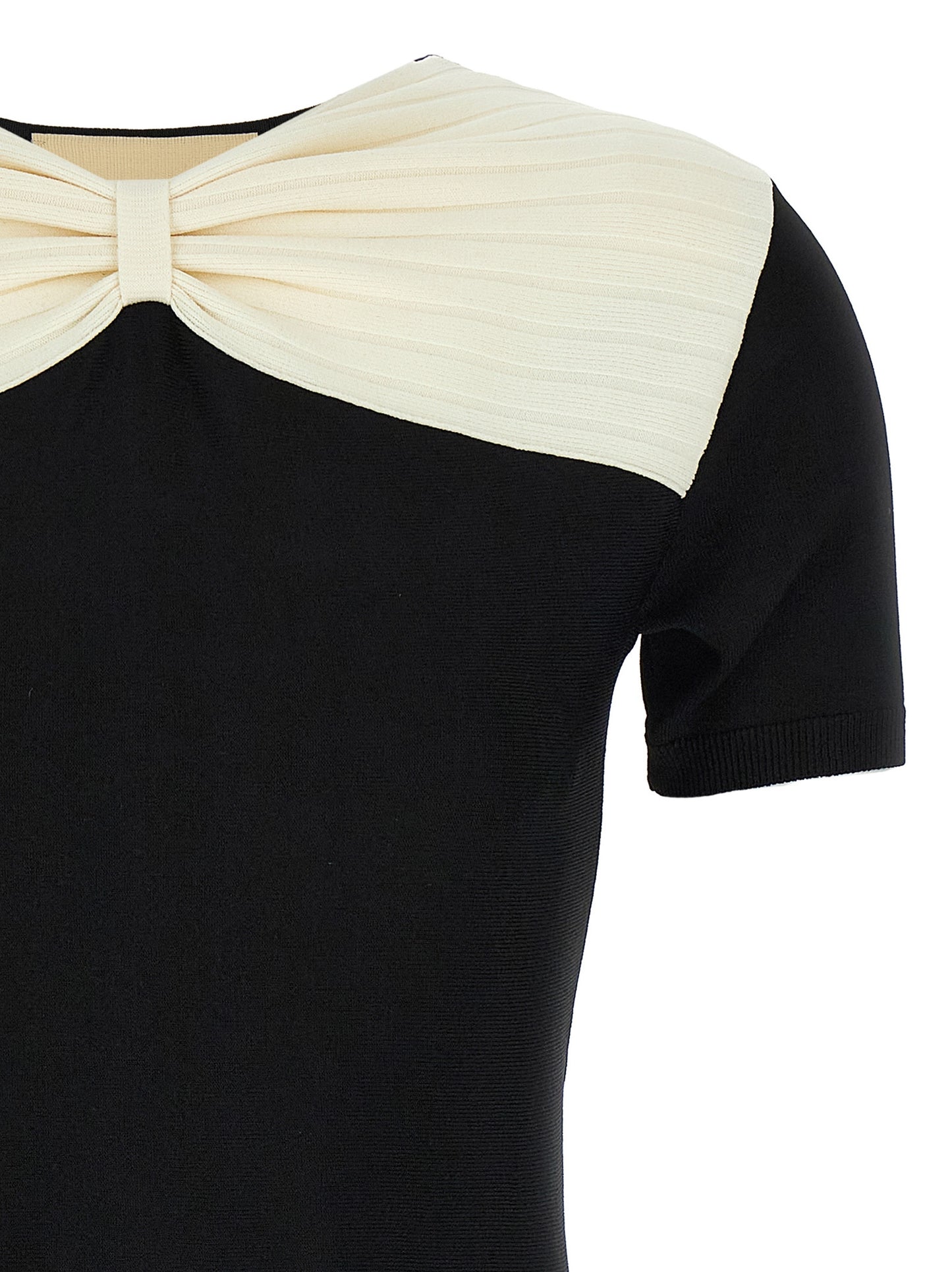 Dress by Valentino Garavani for women in polyester & viscose black features a dramatic silhouette, showcasing an elegant v-neck neckline and that flows into a dramatic short mini.