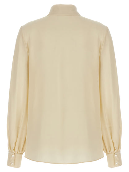 Blouse by Valentino Garavani for women in silk crepe beige showcases a sharp silhouette, elegantly detailed with a sharp and sharp .