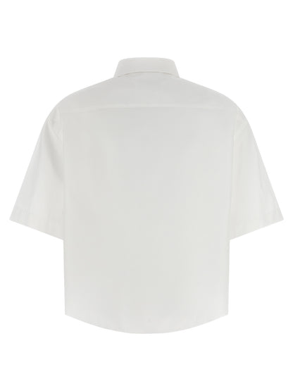 Blouse by Maison Margiela for women in cotton white showcases a sharp silhouette, elegantly detailed with a sharp asymmetric neckline and sharp .