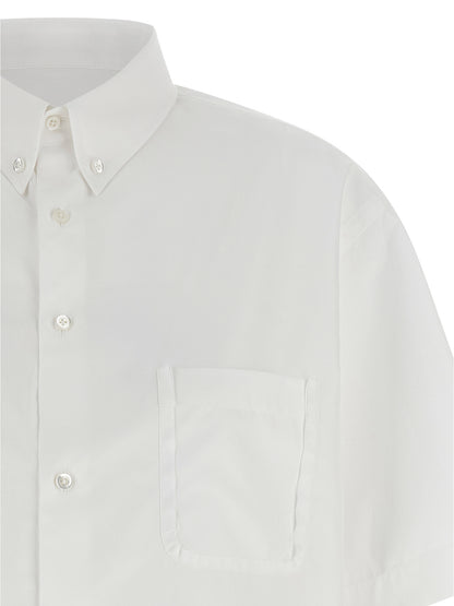 Blouse by Maison Margiela for women in cotton white features an architectural silhouette with a refined and elegant asymmetric neckline for a architectural look.