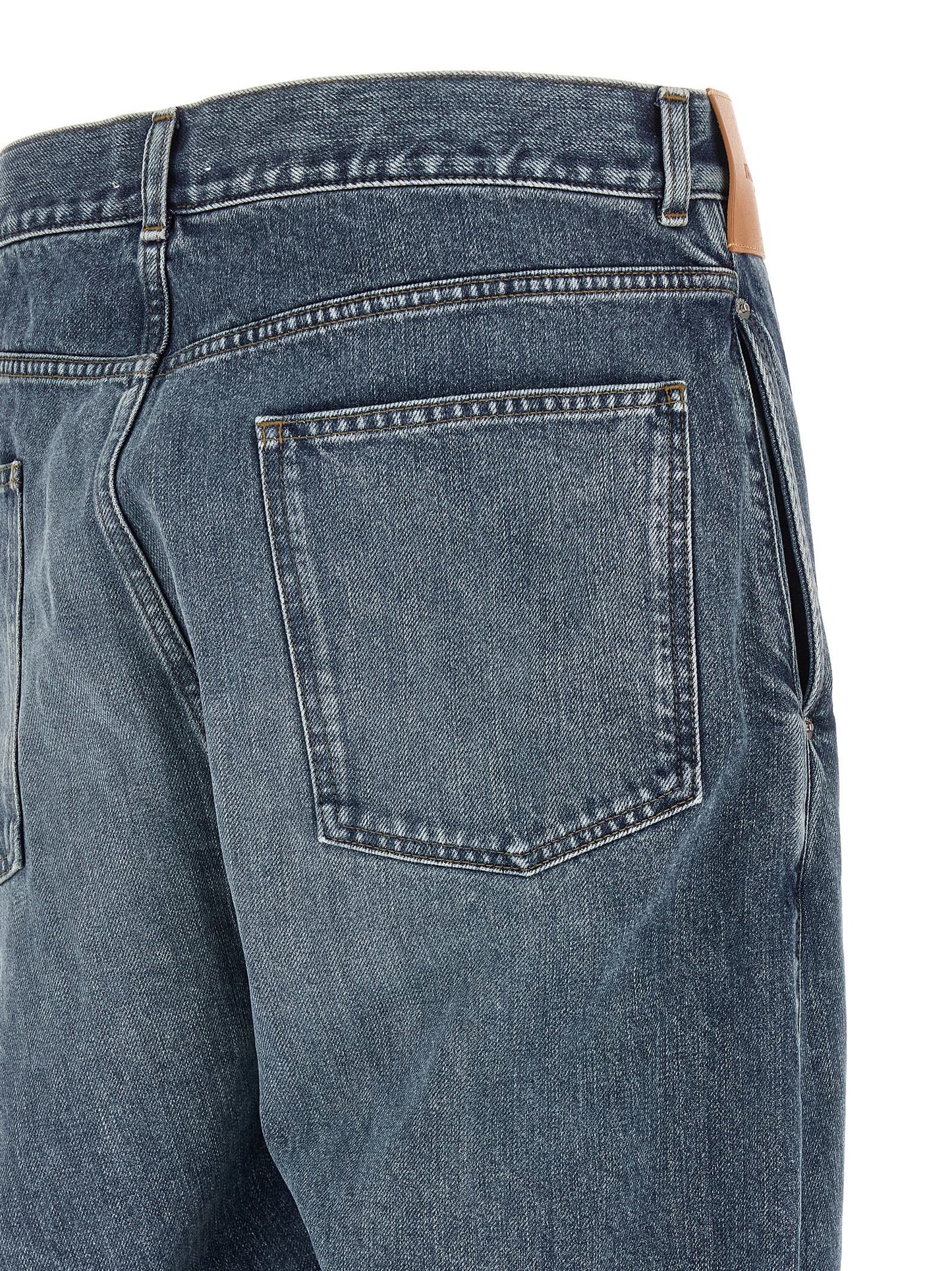 Jeans by J.W.Anderson for men in cotton denim blue & signature features a polished silhouette with a polished wide, reaching a polished long and finished with a polished low rise.