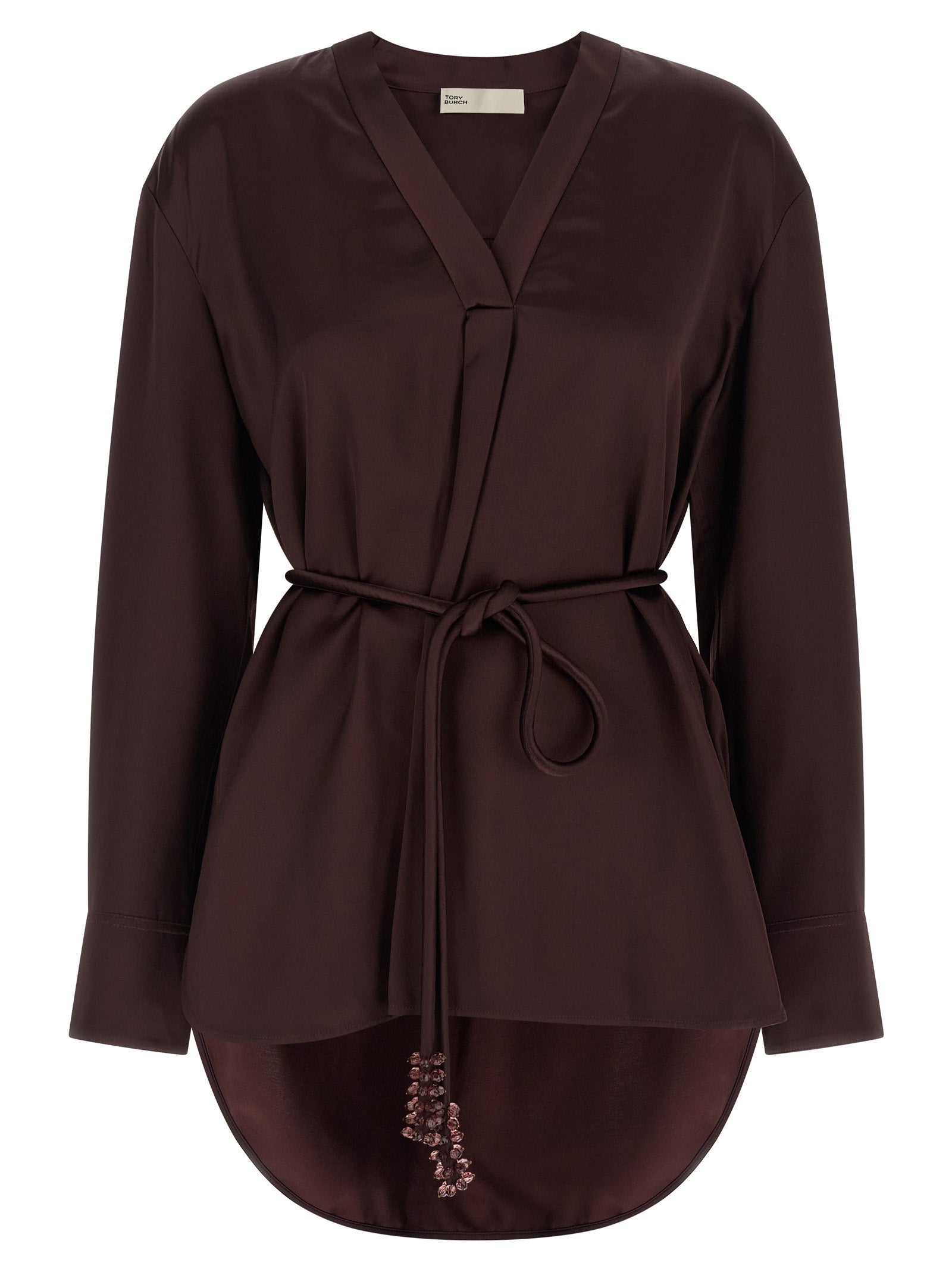 Blouse by Tory Burch for women in satin viscose bordeaux showcases a sublime silhouette, artfully detailed with a sublime v-neck asymmetric neckline and long-sleeve for a sophisticated, sublime finish.