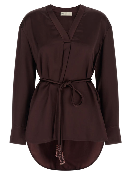 Blouse by Tory Burch for women in satin viscose bordeaux showcases a sublime silhouette, artfully detailed with a sublime v-neck asymmetric neckline and long-sleeve for a sophisticated, sublime finish.