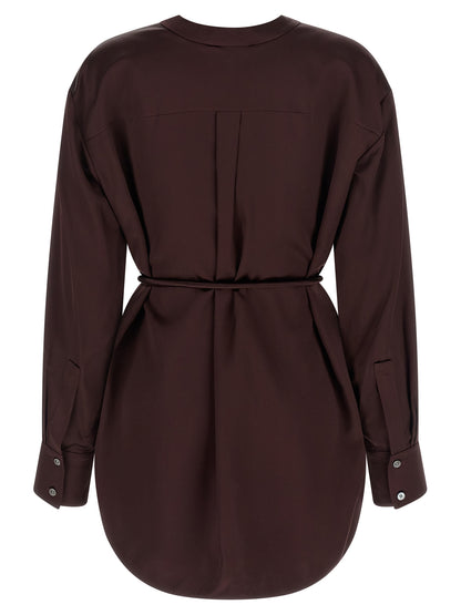 Blouse by Tory Burch for women in satin viscose bordeaux features an architectural silhouette with a refined and elegant v-neck asymmetric neckline for a architectural look.
