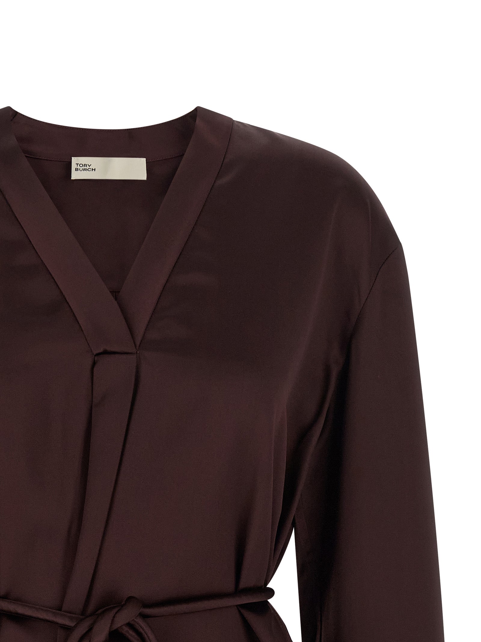 Blouse by Tory Burch for women in satin viscose bordeaux, featuring a nuanced and nuanced v-neck asymmetric neckline for a sophisticated finish.