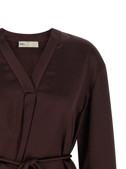 Blouse by Tory Burch for women in satin viscose bordeaux, featuring a nuanced and nuanced v-neck asymmetric neckline for a sophisticated finish.
