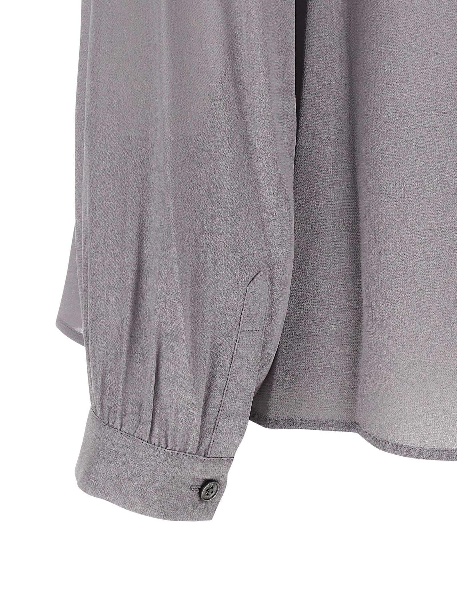 Blouse by Tory Burch for women in viscose gray presents a discerning silhouette, showcasing a sophisticated and for a truly discerning finish.