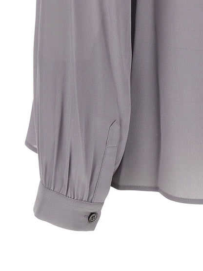 Blouse by Tory Burch for women in viscose gray presents a discerning silhouette, showcasing a sophisticated and for a truly discerning finish.