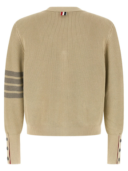 Cardigan by Thom Browne for men in cotton beige & signature features a nuanced silhouette with a refined v-neck neckline and nuanced detailing for a sophisticated look.