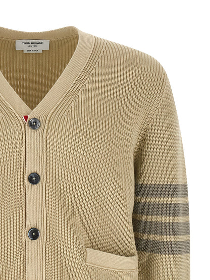 Cardigan by Thom Browne for men in cotton beige & signature showcases a captivating silhouette, artfully detailed with a captivating and v-neck neckline for a truly sophisticated captivating look.