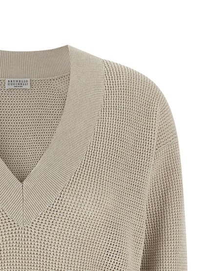 Cardigan by Brunello Cucinelli for women in viscose cotton beige & patterned features an impeccable silhouette, showcasing a sophisticated v-neck neckline and detail for a truly impeccable finish.